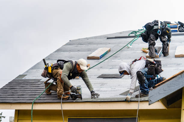 Professional Gutter Installation technician working in Montara, CA